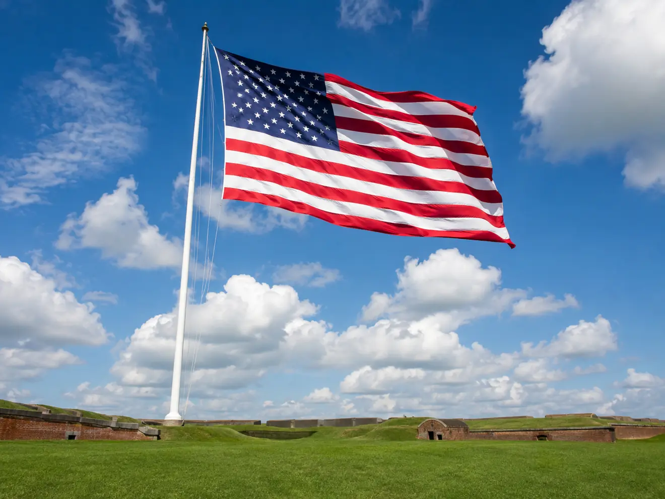 A flag flying over Fort McHenry &mdash; not the original, which is in Washington